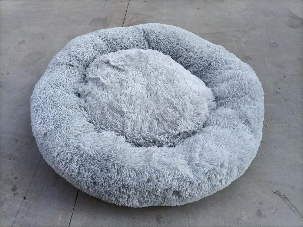 Cozy gray memory foam dog bed with a removable cover, featuring a soft faux fur exterior for ultimate comfort.